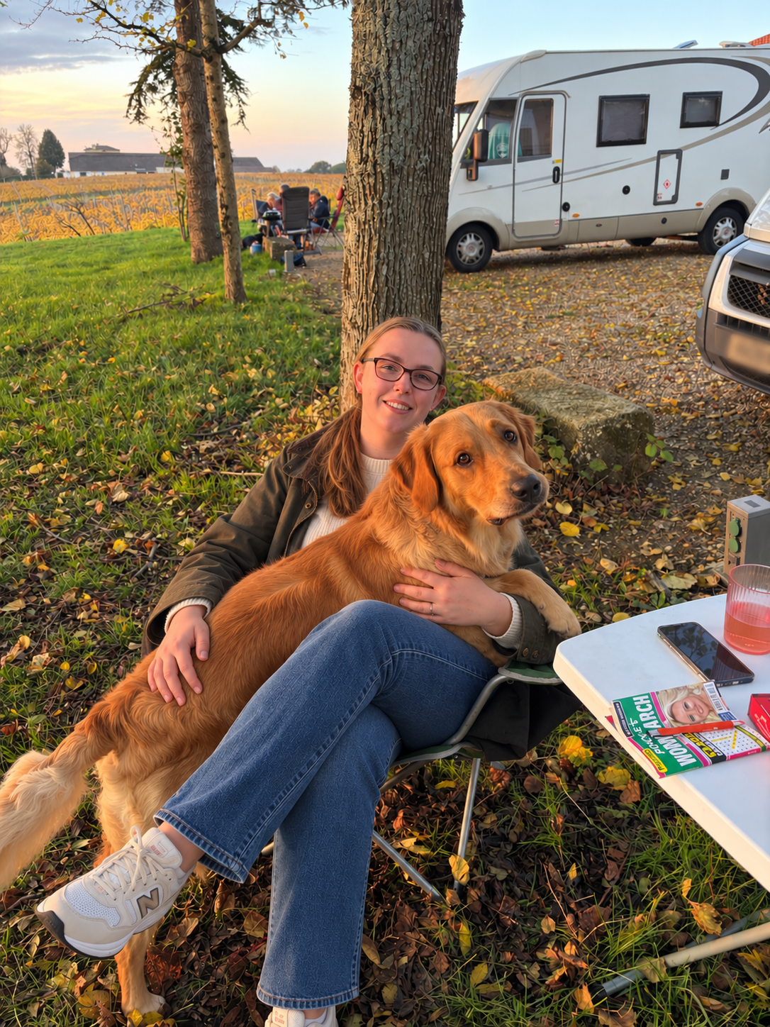 Portrait of Bark & Bramble owner Lauren with Winston the golden retriever
